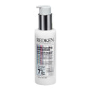 Redken bottle of acidic bonding concentrate on a white background