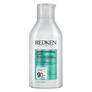 Redken bottle of acidic bonding curl shampoo on a white background