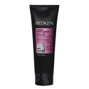 Black tube of Redken Acidic Color Gloss on a white background