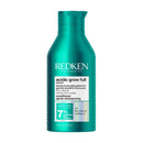 Redken conditioner bottle on a white background