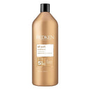 Redken all soft conditioner bottle on a white background