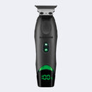 Black hair trimmer with green display on a light gray background