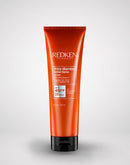 Redken hair care product tube on a white background