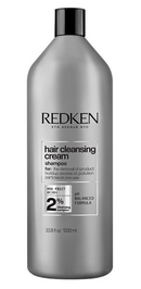 Redken hair cleansing cream shampoo bottle on a white background