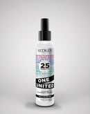 Redken hair product bottle on a gray background