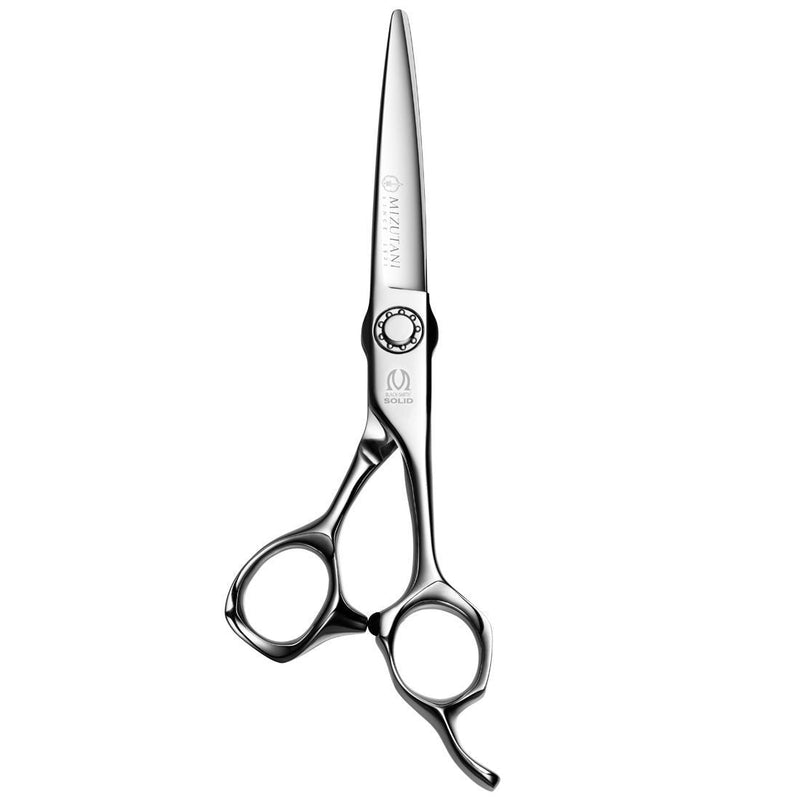 Scissors Lying Flat on Dark Background – The Black-Smith Solid scissors resting on a dark textured surface, accentuating the contrast and premium craftsmanship.
