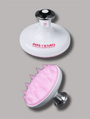 HISTEMO scalp massager system shown in two views: a white round head with a black and silver neck and red brand logo, and a pink silicone scalp stimulator head with a white rim and silver metal base, on a plain gray background.