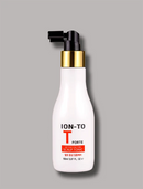 A white bottle of T-TOFFE ION-TO Active Scalp Tonic with a black pump and gold collar, set against a solid gray background.