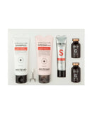 HISTEMO Scalp Care hair care set containing a white shampoo tube, a pink nutrient gel tube, a silver treatment tube, and two dark brown bottles with gold caps, arranged on a light gray background.